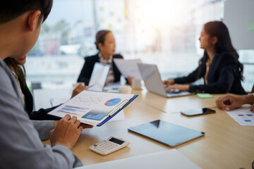 Fototapeta premium Meeting of Asian business people who are committed to work. Creative business team sitting working together at office.