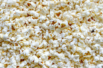 Popcorn texture background. Top view. Snacks and food for a movie