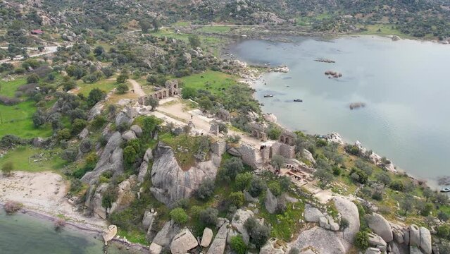 Lake Bafa is a lake and a nature reserve situated in southwestern. At the innermost north-east tip of the lake is the village of Kapikiri, as well as the ruins of Heraclea by Latmus.