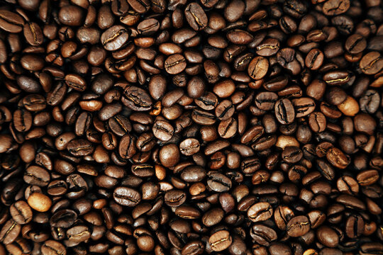 Close-up of roasted brown coffee beans background
