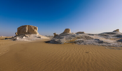Fototapeta na wymiar Fantastic Sandy Formations in the White Desert Protected Area, is National Park in the Farafra Oasis, Egypt