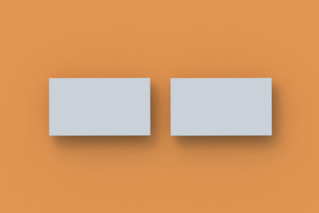 Two stack of business cards on orange background. Top view. 3d render