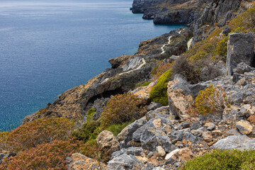 Fototapeta na wymiar beautiful rocky seashore with a path along the sea