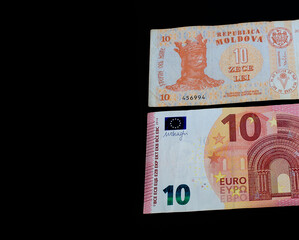 Moldovan lei and euro on black background