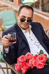 Man drinking tea in a cafe