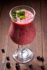 Healthy smoothie from fruits with yogurt. Blended berry of blackcurrant vitamin drink.