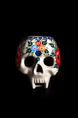 Decorative model of a human skull. Santa Muerte holiday souvenir