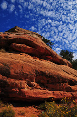 Sandstone formation and Altocumulus clouds on the hike to the House on Fire granary ruins, South Fork of the Mule Canyon, Cedar Mesa, Bears Ears National Monument, southeastern Utah, Southwest USA
