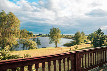 lake, sky and cottage at the forest
