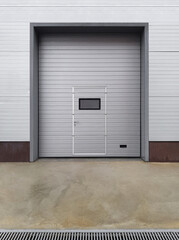 warehouse loading doors. Entrance to a factory or warehouse. loading area. Fragment of the facade...