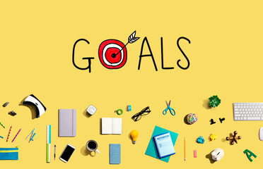 Goal concept with collection of electronic gadgets and office supplies