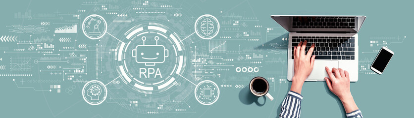 Obraz na płótnie Canvas Robotic Process Automation RPA theme with person using a laptop computer