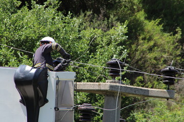 Electrician work maintenance and repair cable in village.