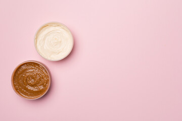 Natural scrub, body cream on color background, top view