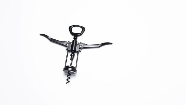 Stop motion. Different levels of black wine bottle opener on white background.