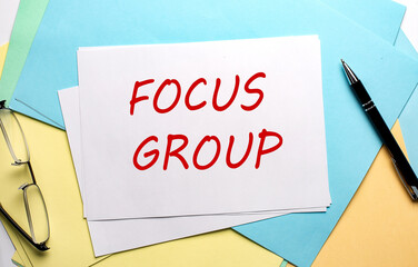 FOCUS GROUP text on paper on the colorful paper background
