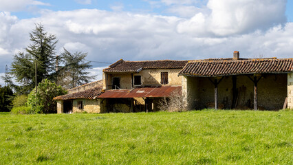 Old country house, in the middle of the fields, on a beautiful sunny spring day
