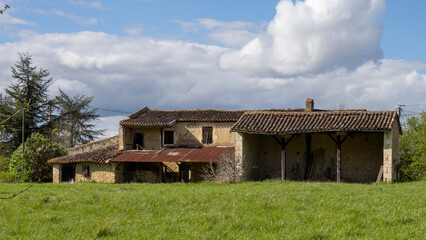 Fototapeta na wymiar Old country house, in the middle of the fields, on a beautiful sunny spring day