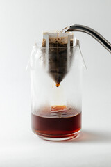 drip coffee brewed in a glass