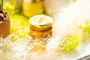 Obraz na płótnie Canvas Selective focus. Linden honey in a jar. Leaves and flowers of linden. Freshly linden honey.