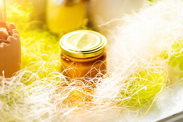 Obraz na płótnie Canvas Selective focus. Linden honey in a jar. Leaves and flowers of linden. Freshly linden honey.