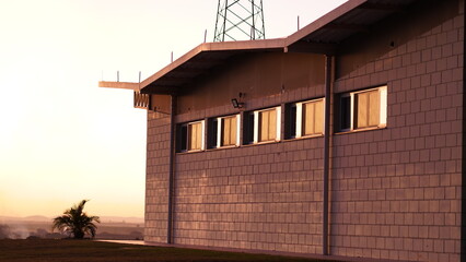 building with sunset light and reflections in the window