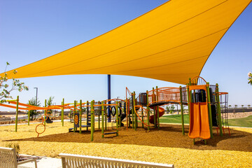 Children's Playground Equipment With Yellow Shade Canopy