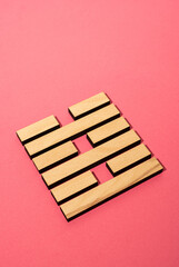 Gene Key 63 wood hexagram i ching on pink background