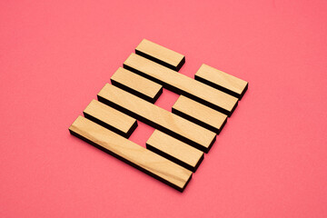 Gene Key 63 wood hexagram i ching on pink background
