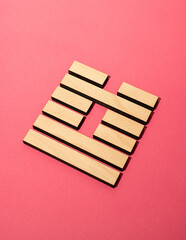 Gene Key 60 wood hexagram i ching on pink background
