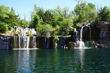 Rock formation, waterfalls, and pond at Daggett Memorial Park in Montello, Wisconsin