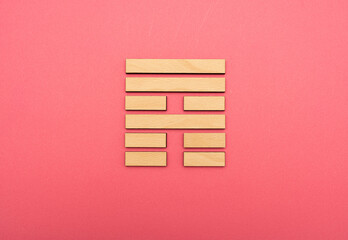 Gene Key 53 wood hexagram i ching on pink background