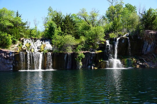 Rock formation, waterfalls, and pond at Daggett Memorial Park in Montello, Wisconsin