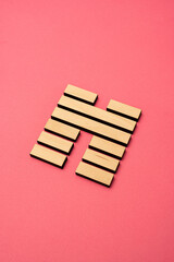 Gene Key 45 wood hexagram i ching on pink background