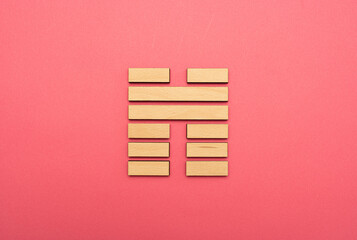 Gene Key 45 wood hexagram i ching on pink background