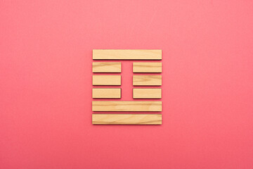Gene Key 41 wood hexagram i ching on pink background