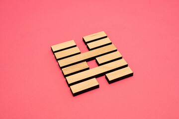 Gene Key 40 wood hexagram i ching on pink background