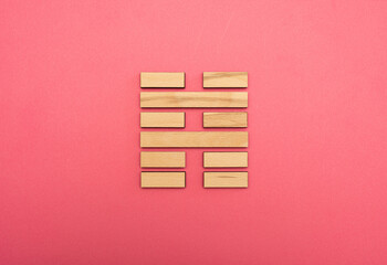 Gene Key 39 wood hexagram i ching on pink background