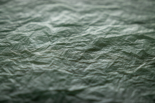 textured background in green and gray tones. blur, defocus.
