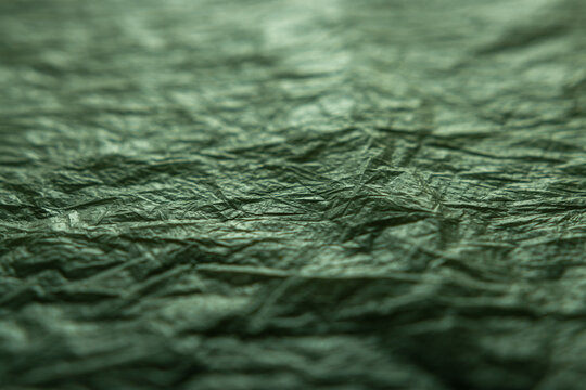textured background in green and gray tones. blur, defocus.