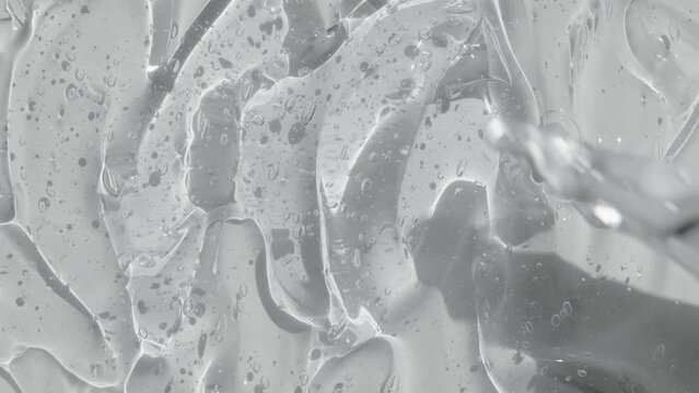 Hyaluronic acid with bubble. Transparent gel serum texture spreading footage. Liquid cosmetic skincare toner beauty product with peptide and collagen. Cleanser abstract background video 4k. 