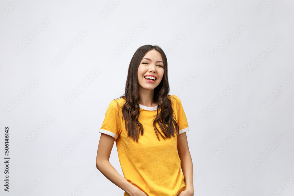 Wall mural Young friendly Asian woman with smiley face isolated on white background