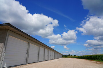 Storage units along side of corn field