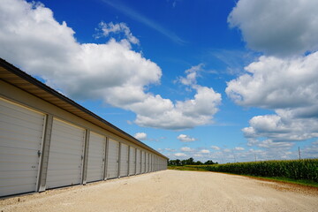 Storage units along side of corn field