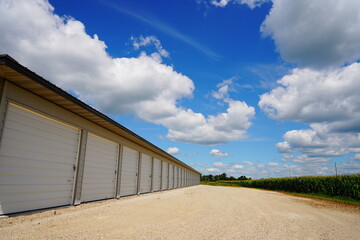 Storage units along side of corn field