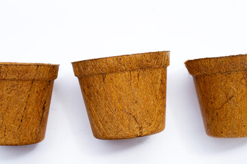 Coco coir pots on white background.