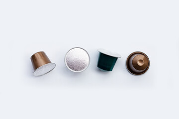 Coffee capsules on white background.