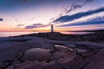Peggy's Cove Lighthouse during a vibrant sunset. Atlantic Coast, Nova Scotia, Canada. The most visited tourist location in the Atlantic Canada © Prashanth Bala