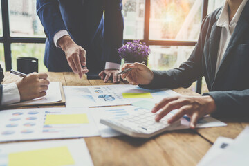 Asian business advisor meeting to analyze and discuss the situation on the financial report in the meeting room. brainstorming, discussing, and analyzing business strategy. Financial advisor concept