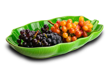 Bunches of ripe red grapes, black grapes and purple grapes in green ceramic plate isolated on white background.